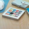 Snooker ball image puzzle in shiny metal case presented in a bla